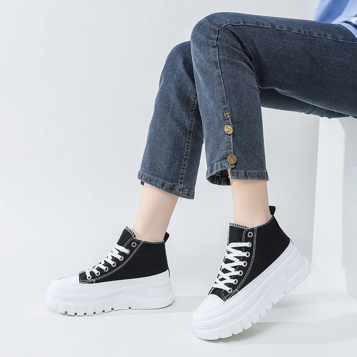 White canvas sneakers with thick sole